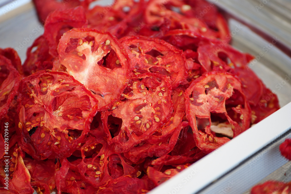 homemade tomato drying process,close-up of sun dried tomatoes at home,
