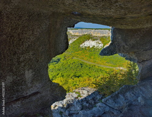 Russia, the Republic of Crimea. A view from inside the dilapidated stone room of the famous cave city of Mangup-Kale of the 5th century in the Bakhchisarai district. photo