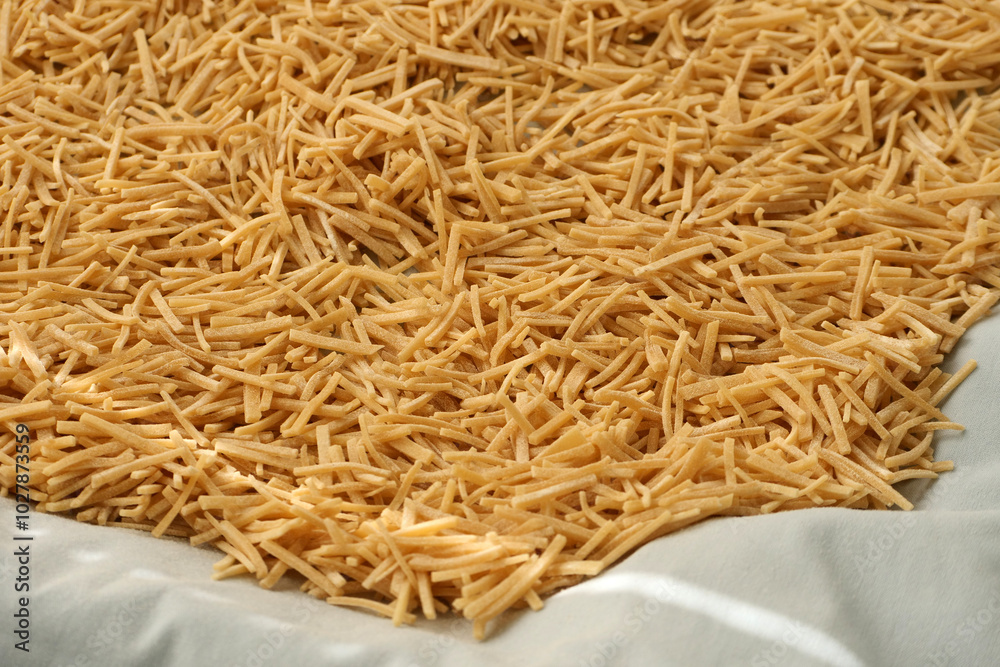 Cutting noodles from homemade natural wheat flour dough,