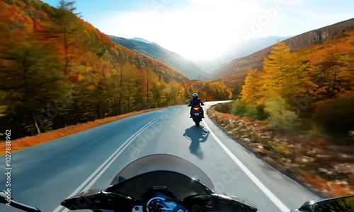 riding a motorcycle on the open road in the autumn season