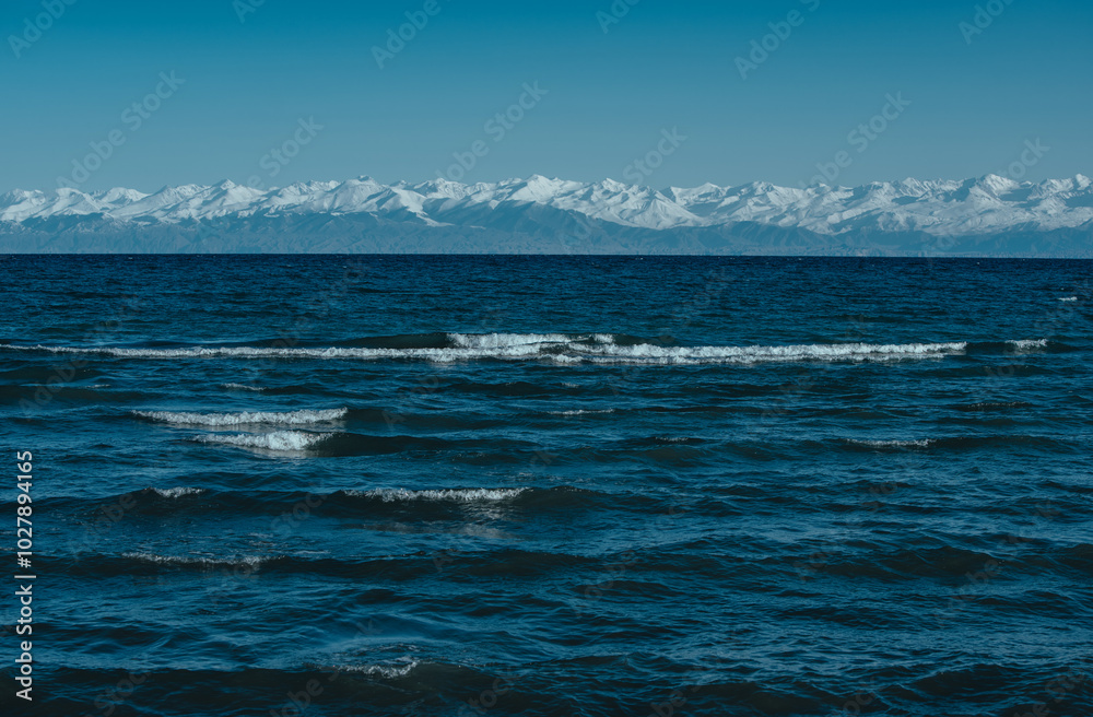 Issky-kul lake in Kyrgyzstan, summer picturesque landscape Issky-kul lake in Kyrgyzstan, summer picturesque landscape