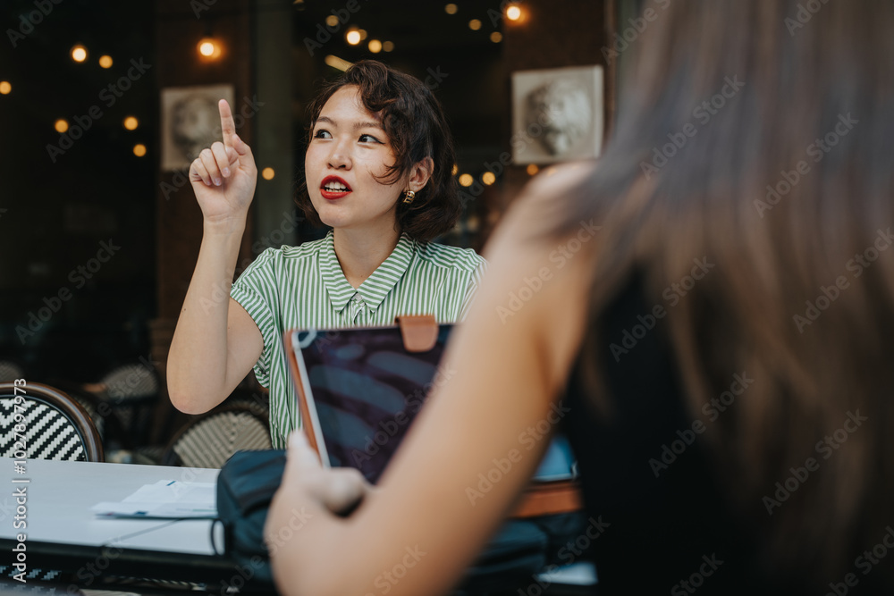 Young woman engaged in a discussion at a meeting in a cozy cafe, expressing a point. Energetic and communicative atmosphere. Young woman engaged in a discussion at a meeting in a cozy cafe, expressing a point. Energetic and communicative atmosphere.