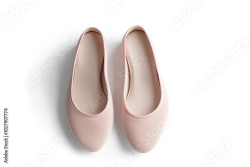 Stylish pair of soft pink ballet flats designed for comfort and elegance.