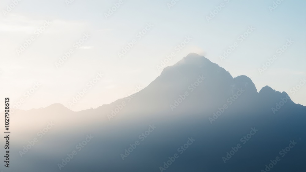 Serene Mountain View at Dawn with Soft Mist Serene Mountain View at Dawn with Soft Mist