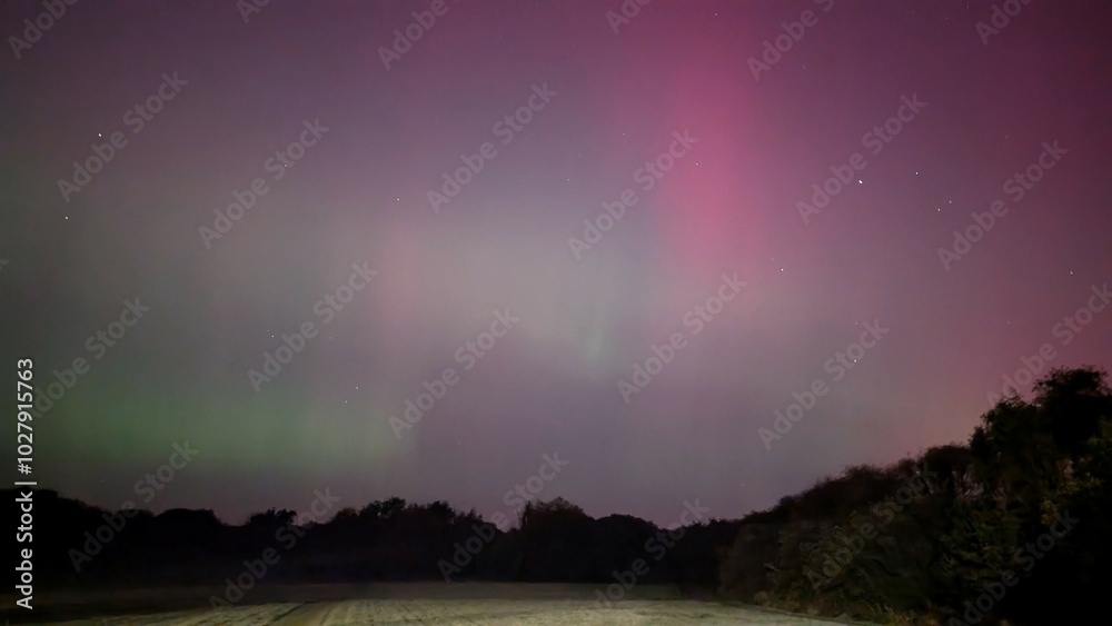 Aurora borealis, northern lights in the sky above Dangan, Galway, Ireland, nature background