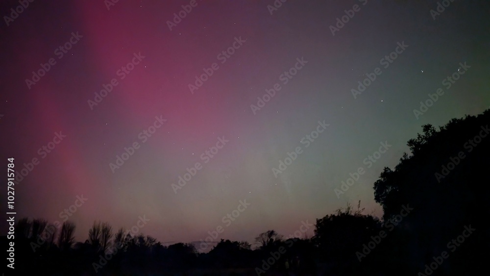 Aurora borealis, northern lights in the sky above Dangan, Galway, Ireland, nature background