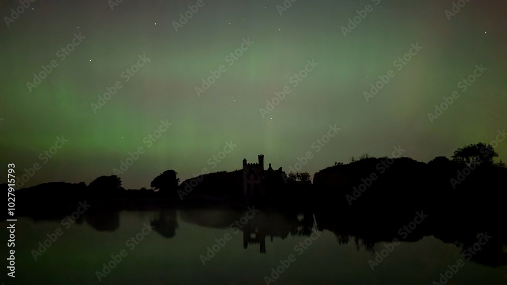 Aurora borealis, northern lights in the sky above Menlo castle, Galway, Ireland, nature background