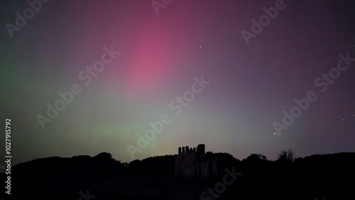 Obraz na płótnie Aurora borealis, northern lights in the sky above Menlo castle, Galway, Ireland, nature background w salonie