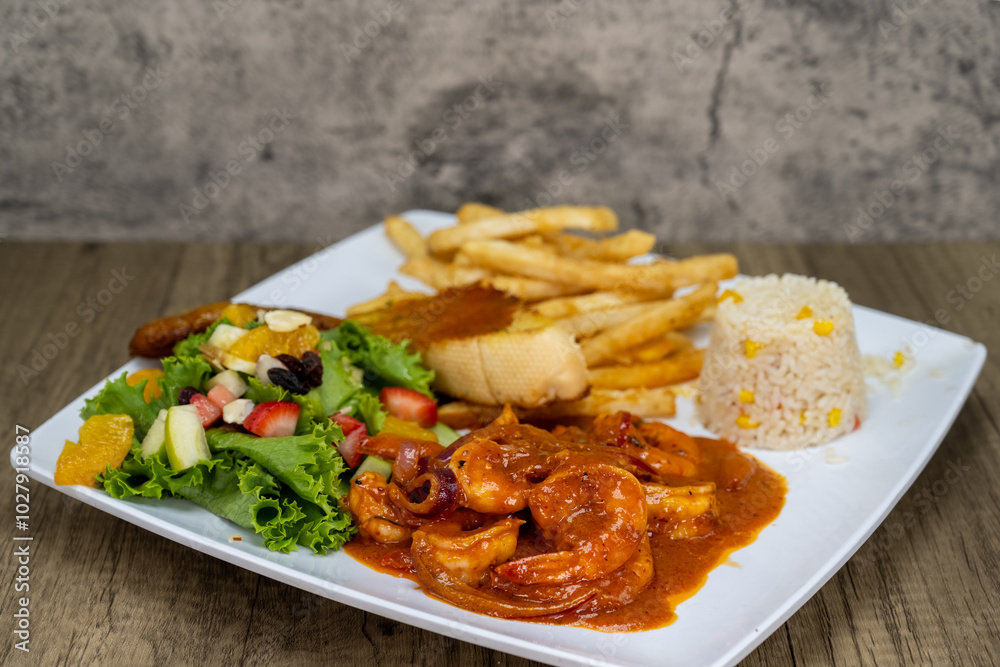 Grilled spicy shrimp diablo served with french fries, toast, and rice for a delicious Mexican seafood dinner Grilled spicy shrimp diablo served with french fries, toast, and rice for a delicious Mexican seafood dinner