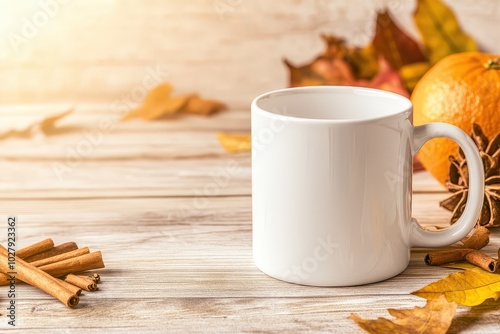 A cozy autumn setting with a white mug, warm spices, and seasonal decorations on a wooden table