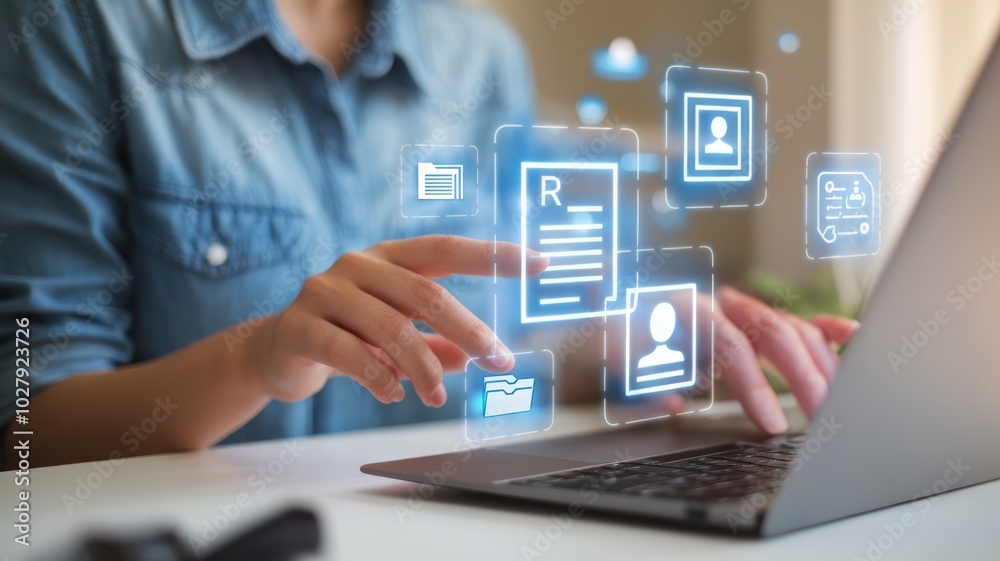 Person using laptop with holographic interface and digital icons. Person using laptop with holographic interface and digital icons.