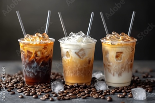 Trio of iced coffee drinks in clear cups, with varying levels of milk and cream, straws, and ice