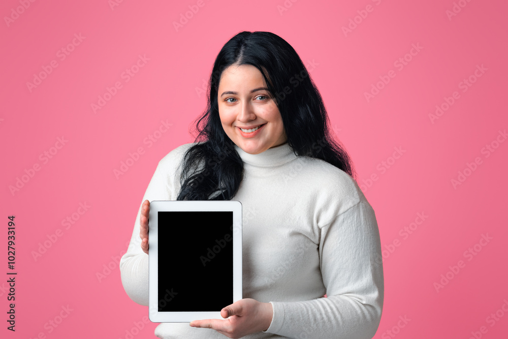 Weight Loss App Concept. Smiling Plump Woman Demonstrating Digital Tablet With Blank Black Screen, Posing Over Pink Background, Empty Space Weight Loss App Concept. Smiling Plump Woman Demonstrating Digital Tablet With Blank Black Screen, Posing Over Pink Background, Empty Space