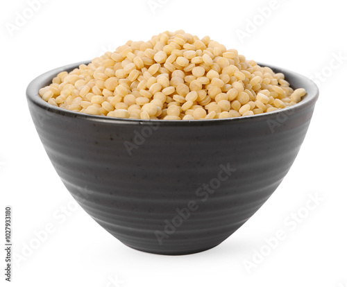 Raw couscous in bowl isolated on white