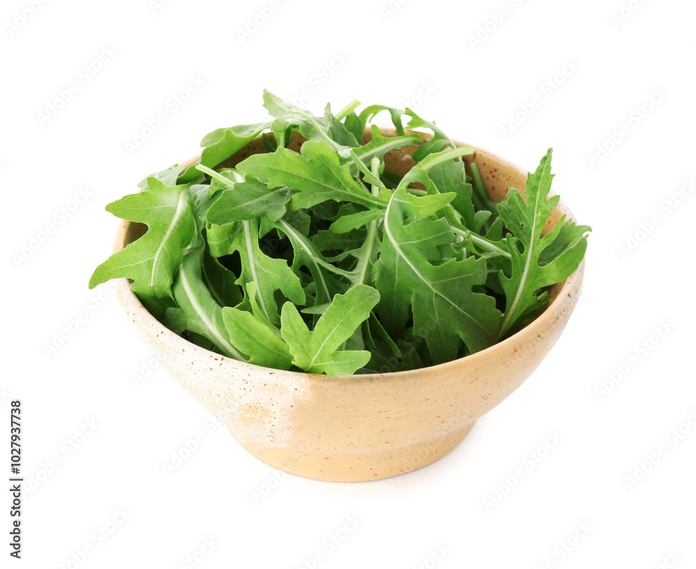 Fresh arugula leaves in bowl isolated on white Fresh arugula leaves in bowl isolated on white