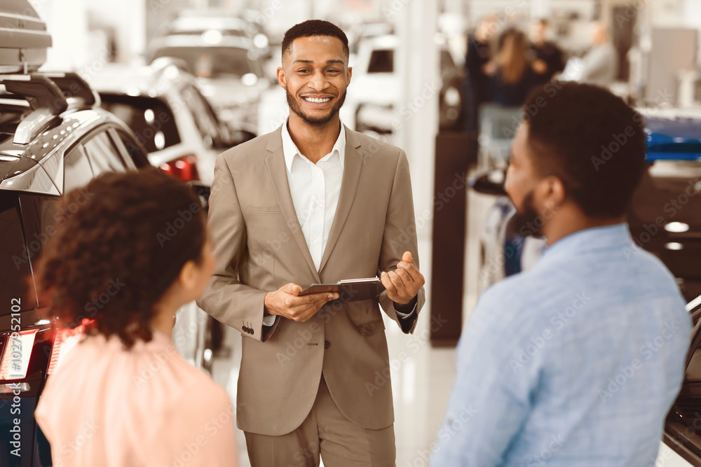 Car Sales Business. Auto Dealer Manager Talking With Couple Clients Selling Automobile In Dealership Store. Selective Focus