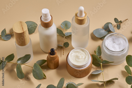 Natural cosmetics in bamboo glass packaging on white background. SPA organic beauty products set. Skin care concept. photo