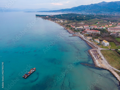 Panoramic view of astrakeri beach with mountains in the background photo