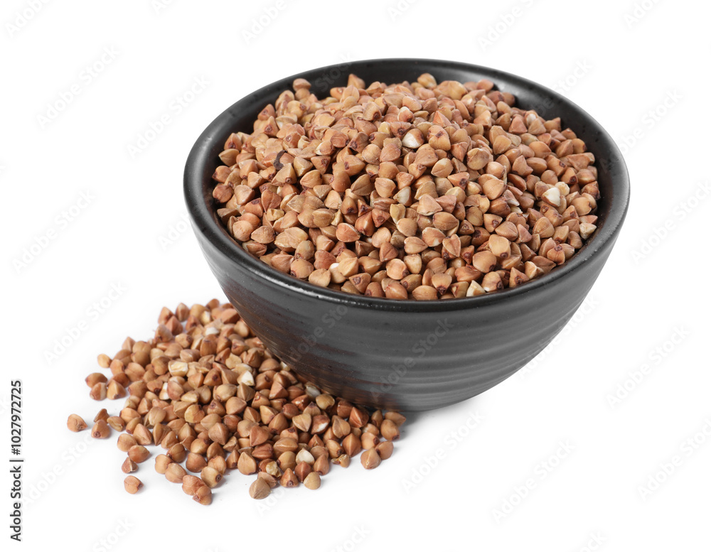 Raw buckwheat in bowl isolated on white Raw buckwheat in bowl isolated on white