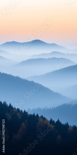 Silhouettes of forested hills and trees bathed in the warm glow of sunset, featuring a beautiful blue and orange gradient, embodying nature's minimalist beauty with a hint of mist