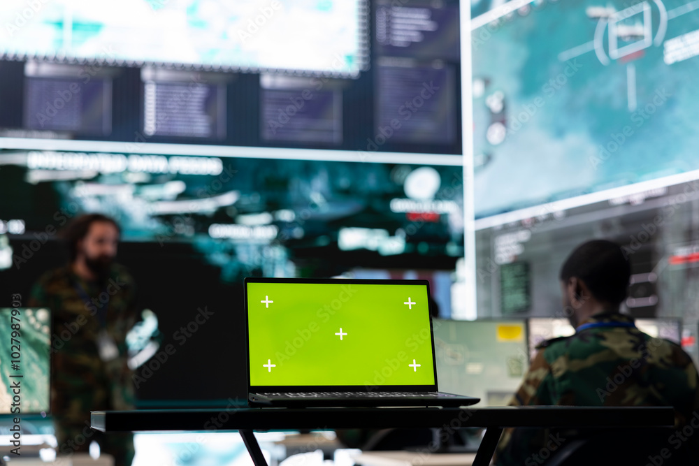 Green screen running on laptop in military base of operations, team of army soldiers monitoring coast line traffic activity to ensure national safety. Troopers detecting suspicious vessels on radar. Green screen running on laptop in military base of operations, team of army soldiers monitoring coast line traffic activity to ensure national safety. Troopers detecting suspicious vessels on radar.