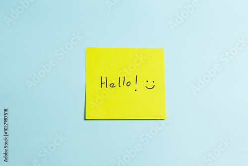 A yellow sticky note with the word 