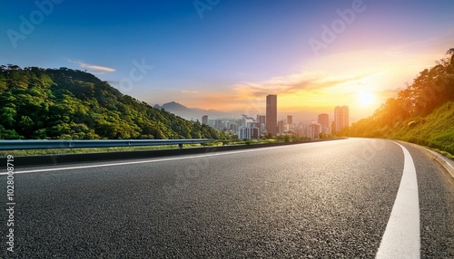 Obraz na płótnie asphalt highway road and green mountain with city skyline at sunset w salonie