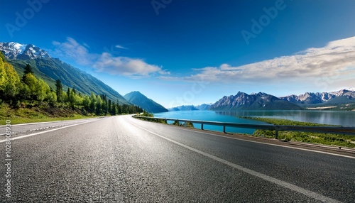 asphalt road and river with mountain nature landscape under blue sky