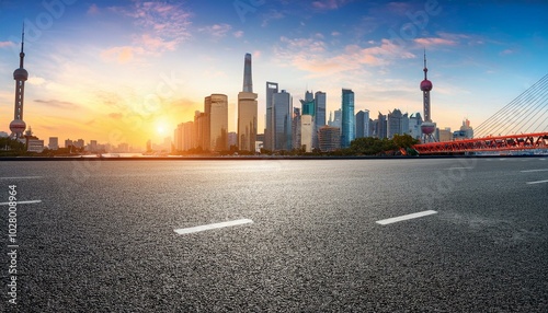 asphalt road square and bridge with city skyline at sunset in shanghai