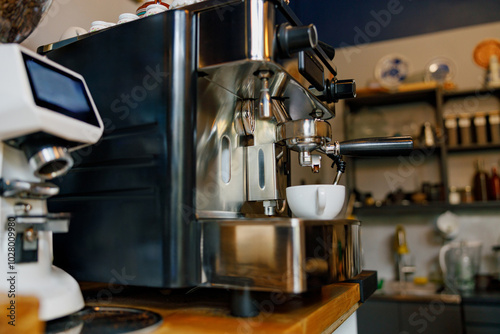 A sleek and polished espresso machine delivering rich coffee in a vibrant contemporary cafe atmosphere