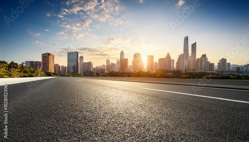 panoramic city skyline and buildings with empty asphalt road at sunset