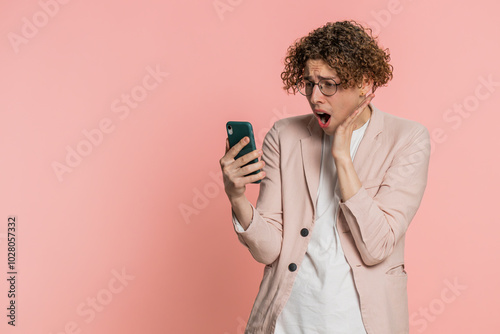 Fotografie Upset sad Caucasian man use smartphone typing browsing, play game, loses, surprised by sudden lottery results bad fortune loss fail unlucky news