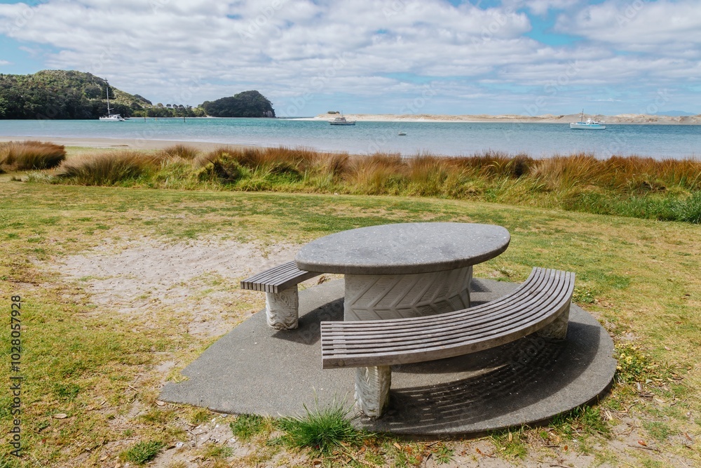 Picnic table in the beach harbour of Mangawhai Harbour, Mangawhai ...