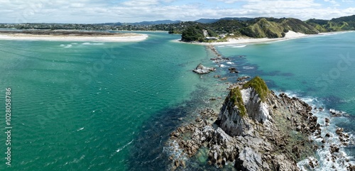 Rocky island, harbour entrance and sandspit of the Mangawhai Heads, Mangawhai, Northland, New Zealand. photo