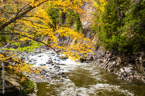 Coaticook, Canada - Oct. 12 2024: Colorful autumn season in Parc de la Gorge photo