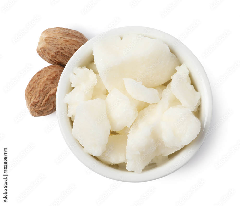Shea butter in bowl and nuts isolated on white, top view Shea butter in bowl and nuts isolated on white, top view