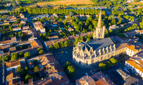 View from drone of houses of Mirepoix town and cathedral of St-Maurice at sunny summer day, France photo