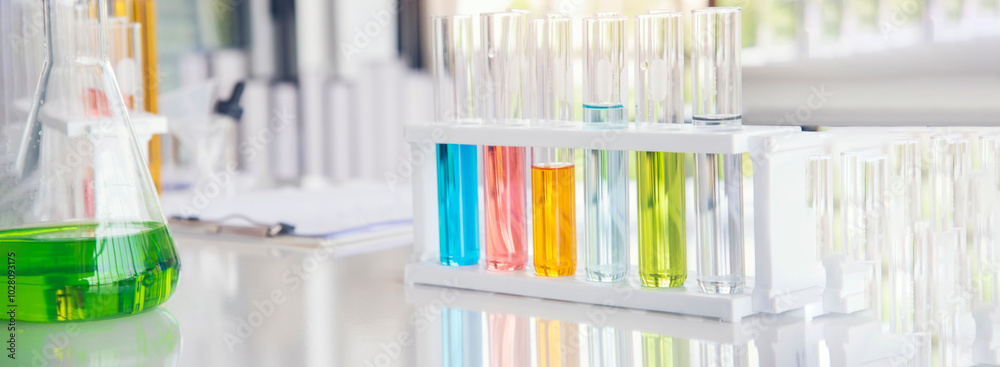 Banner Science laboratory chemistry test science lab with microscope glass tubes chemical beaker scientific background. Colorful Liquid biology laboratory fluid scientist experiment with copy space Banner Science laboratory chemistry test science lab with microscope glass tubes chemical beaker scientific background. Colorful Liquid biology laboratory fluid scientist experiment with copy space