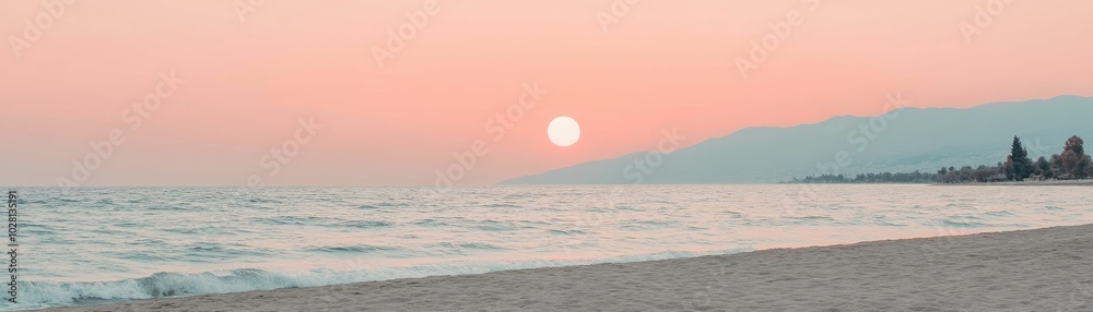 A peaceful beach at sunset with soft waves gently rolling onto the shore, distant mountains silhouetted against the pastel sky.. A peaceful beach at sunset with soft waves gently rolling onto the shore, distant mountains silhouetted against the pastel sky..