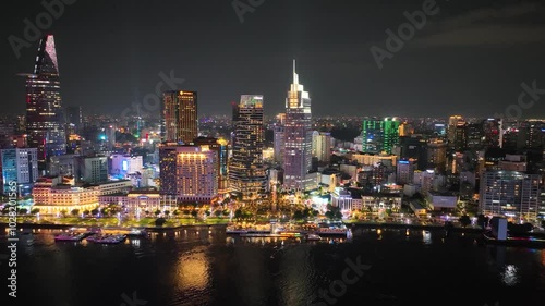 Wallpaper Mural Night view of Ho Chi Minh City's illuminated skyline reflecting on the Saigon River Torontodigital.ca