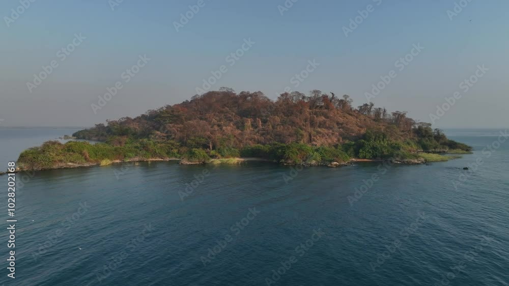 Approaching aerial drone view of Nankoma Island, Lake Malawi National Park, Malawi. Approaching aerial drone view of Nankoma Island, Lake Malawi National Park, Malawi.