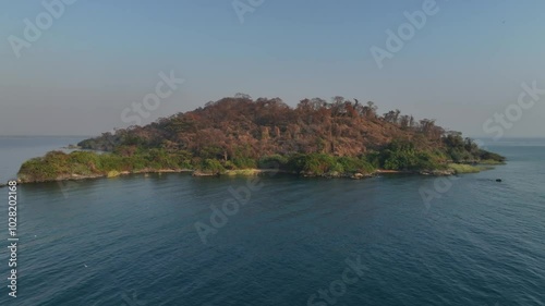 Approaching aerial drone view of Nankoma Island, Lake Malawi National Park, Malawi. photo