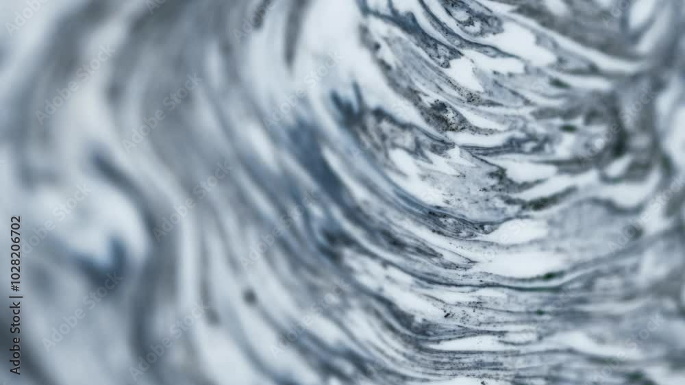 Liquid marble. Acrylic paint spill. Blur black white gray color pigment powder grain particles ink drip emulsion fluid mix wave motion abstract art background.