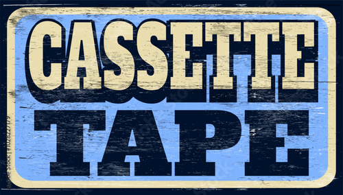 Aged and worn cassette tape sign on wood