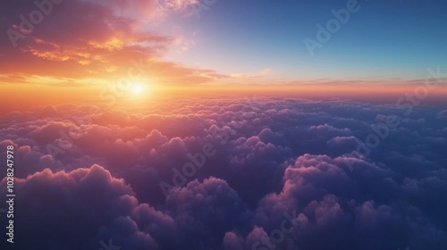 2408 54.A stunning view of the sky at dawn, where clouds float lazily in the early morning light. The sky is a gradient of deep blue and bright orange, with the sun peeking over the horizon, casting