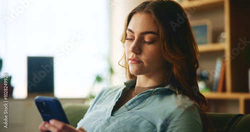 Home, relax and woman with phone in living room for online communication, network and reading text. Internet, connection and female person with technology in house for notification of social media