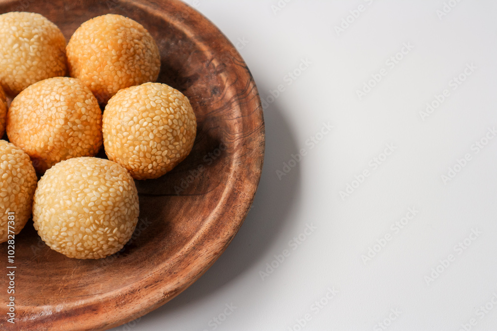 onde onde or sesame seed ball on a plate, popular traditional food in Indonesia onde onde or sesame seed ball on a plate, popular traditional food in Indonesia