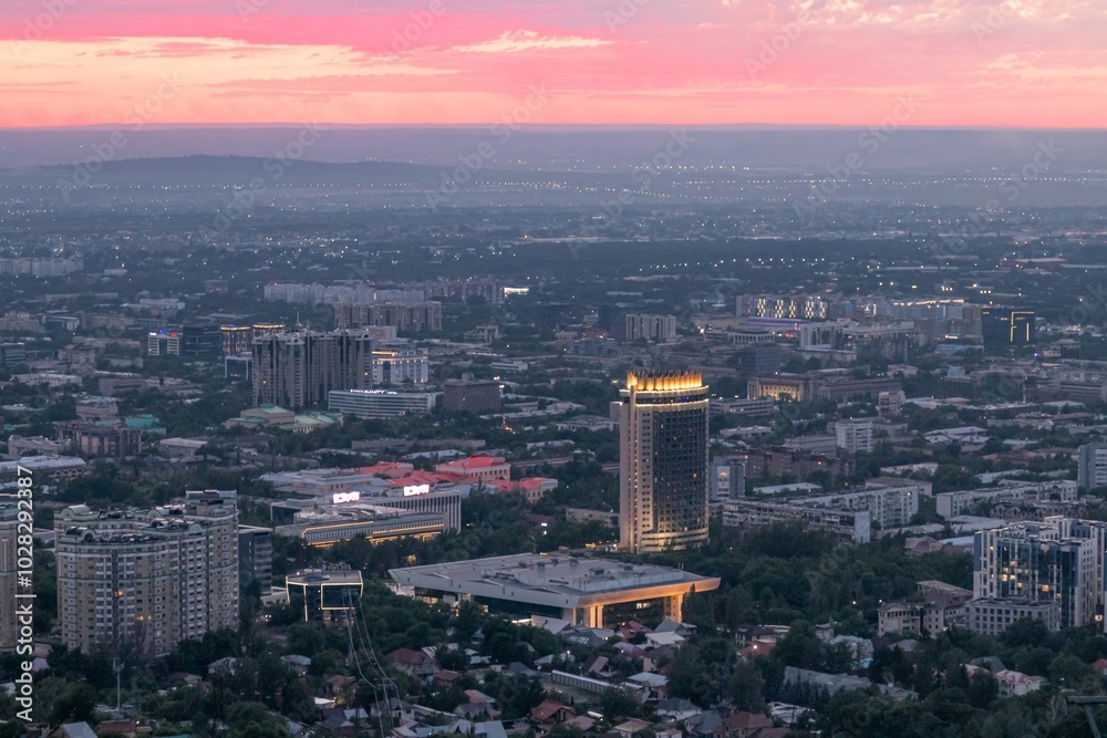 Fototapeta premium Panoramic view of the city of Almaty from the observation deck, sunset, summer time. Sights of Kazakhstan.