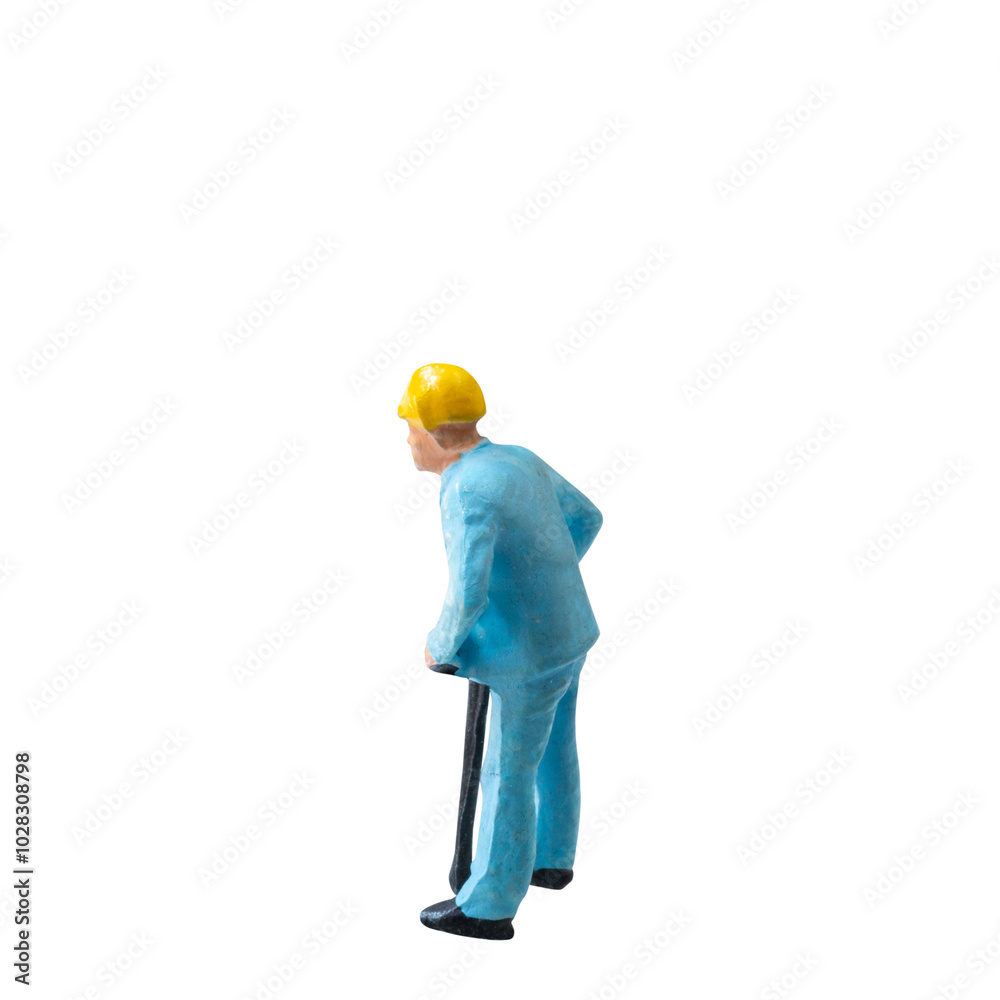 Miniature construction worker in a blue uniform isolate on white background with clipping path Miniature construction worker in a blue uniform isolate on white background with clipping path