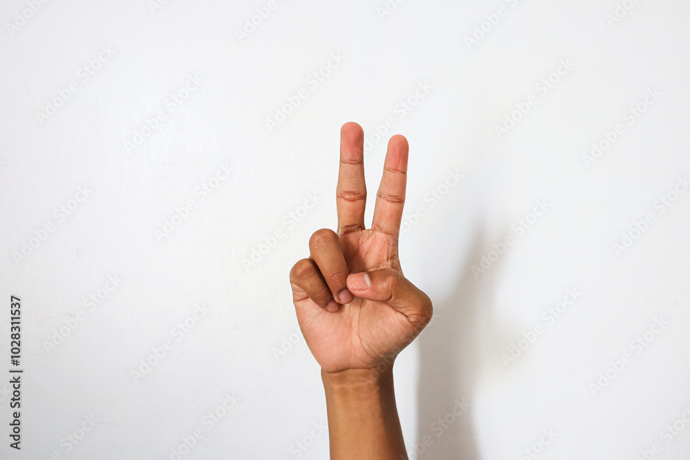Indonesian hand with 2 open finger gesture Indonesian hand with 2 open finger gesture
